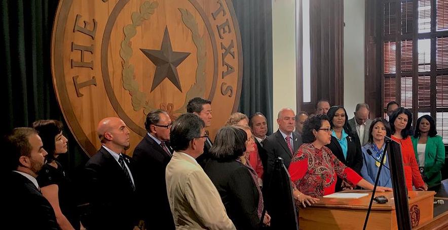 Texas Rep. Celia Israel speaks with individuals.