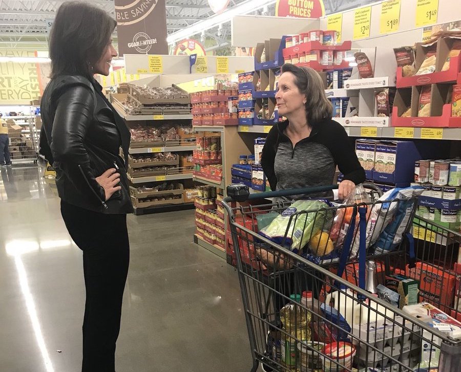 Illinois Rep. Cheri Bustos speaking with a resident of her district.